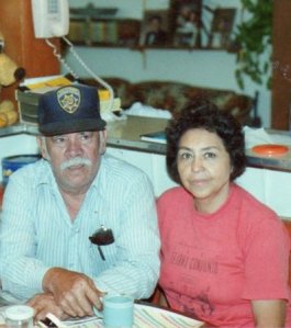 My parents sitting at their kitchen table ca. 1990